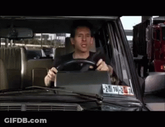A Man Is Driving A Car With A License Plate That Says 20-22 GIF