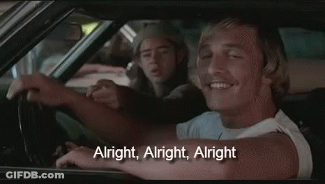 A Man Is Driving A Car With A Woman Sitting In The Back Seat . GIF