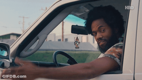 A Man Is Driving A Car With Hbo Written On The Bottom Right GIF