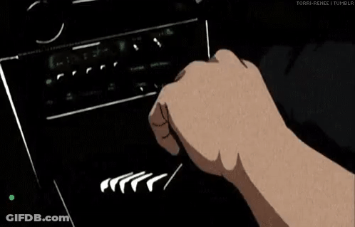 A Man Is Driving A Car With His Hands On The Steering Wheel . GIF