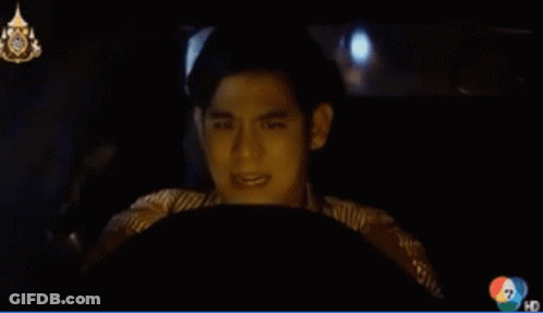 A Man Is Driving A Car With The Number 7 On The Bottom GIF