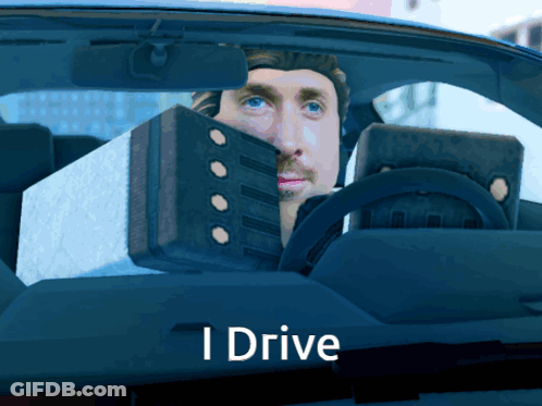 A Man Is Driving A Car With The Words " I Drive " Below Him GIF