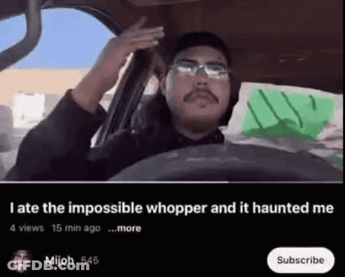 Man Driving Car With Impossible Whopper Haunted Text GIF