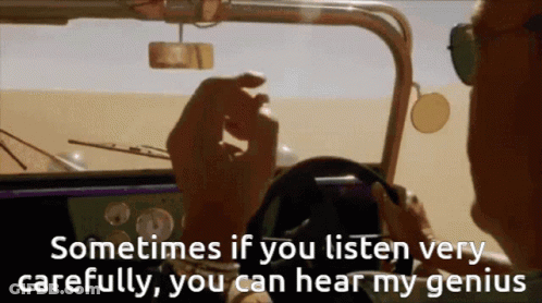A Man Is Driving A Car With The Words " Sometimes If You Listen Very Carefully You Can Hear My Genius " GIF