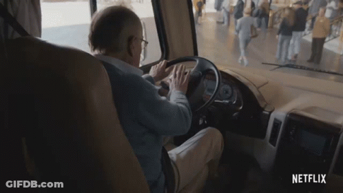 A Man Is Driving A Rv With Netflix Written On The Bottom Of The Screen GIF