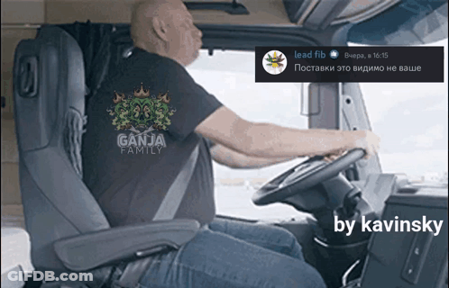 A Man Is Driving A Truck With A Ganja Family Shirt On GIF