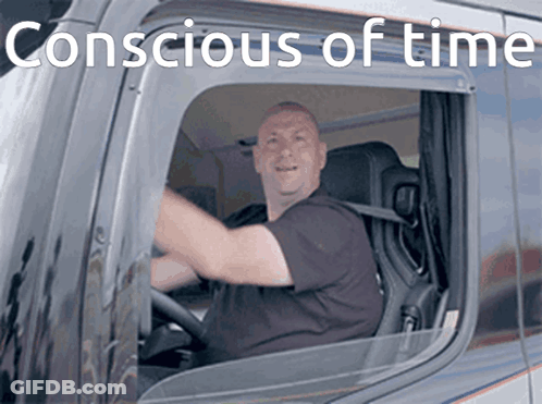 A Man Is Driving A Truck With The Words " Conscious Of Time " Written Above Him GIF