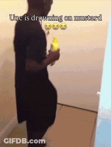 A Man Is Drowning On Mustard While Holding A Yellow Banana GIF