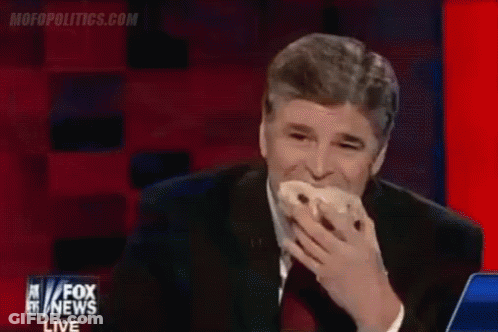 A Man Is Eating A Donut On Fox News GIF