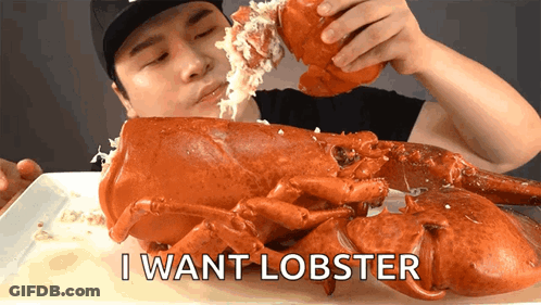 A Man Is Eating A Large Lobster With The Words " I Want Lobster " Written On The Bottom GIF