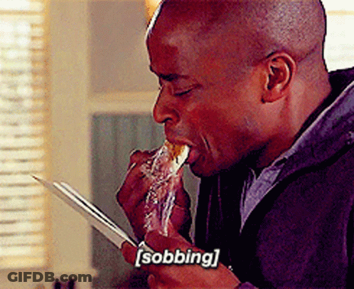 A Man Is Eating A Piece Of Food With The Word Sobbing Written On The Bottom GIF
