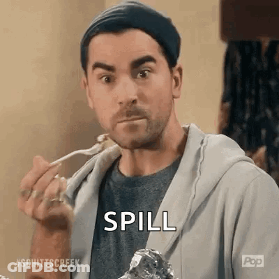 A Man Is Eating A Piece Of Meat With A Fork And A Spoon . GIF