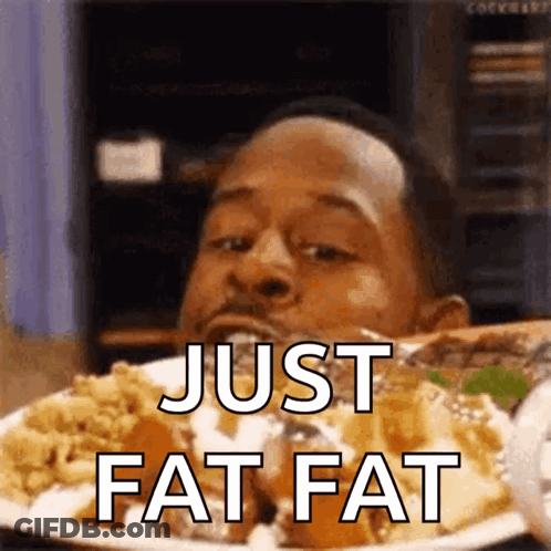 A Man Is Eating A Plate Of Food And The Words Just Fat Fat Are On The Plate GIF