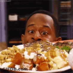A Man Is Eating A Plate Of Food With The Word Cockbarf On The Bottom Right GIF