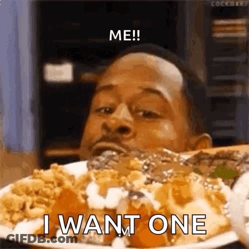A Man Is Eating A Plate Of Food With The Words `` Me ! I Want One '' Written On It . GIF