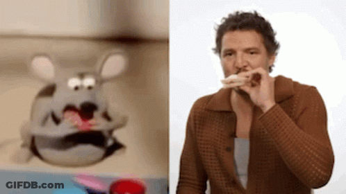 A Man Is Eating A Sandwich Next To A Stuffed Animal . GIF