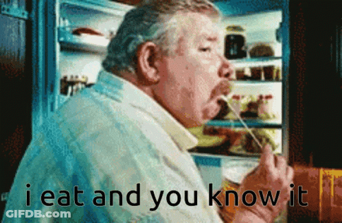 A Man Is Eating Something In Front Of A Refrigerator With The Words " I Eat And You Know It " GIF