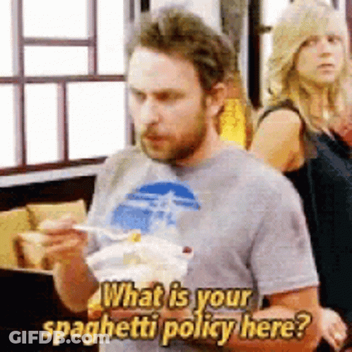 A Man Is Eating Spaghetti And Asking What Is Your Spaghetti Policy Here GIF