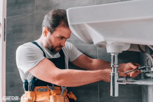 A Man Is Fixing A Sink With A Wrench And The Website Imgflip.com Is Below Him GIF