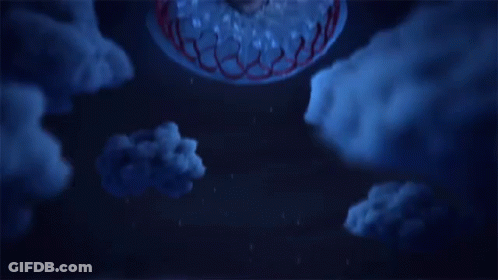 A Man Is Floating In The Air With A Cake In His Head GIF