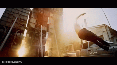 A Man Is Flying Through The Air In Front Of A Truck That Says Ram 3500 GIF