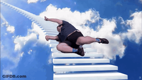 A Man Is Flying Through The Air On A Staircase GIF