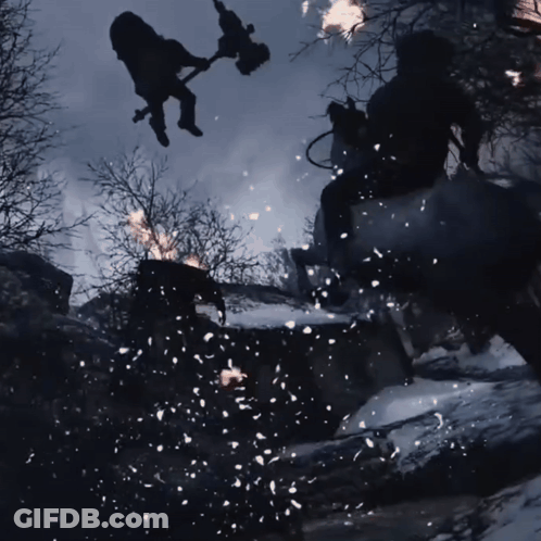 A Man Is Flying Through The Air While Holding A Torch GIF