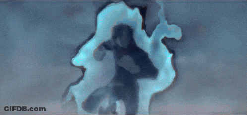 A Man Is Flying Through The Air With A Blue Light Coming Out Of His Hands GIF