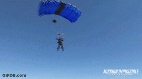 A Man Is Flying Through The Air With A Mission Impossible Logo In The Background GIF