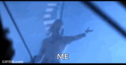 A Man Is Flying Through The Air With His Arms Outstretched And The Words `` Me '' Written Below Him . GIF