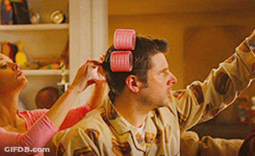 Man Getting Hair Curled By Woman GIF