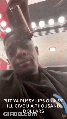 A Man Is Getting His Hair Cut At A Barber Shop And Says `` Put Ya Pussy Lips On Live '' . GIF