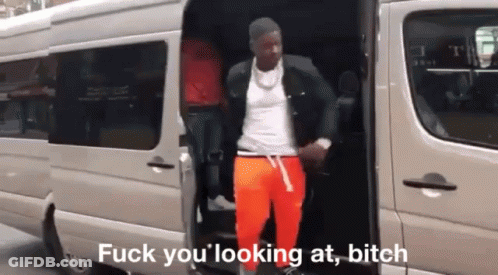 A Man Is Getting Out Of A Van With The Words Fuck You Looking At Bitch Written On The Bottom GIF