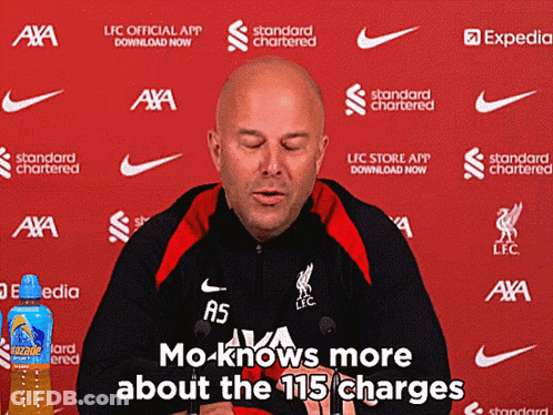 A Man Is Giving A Press Conference With The Words Mo Knows More About The 115 Charges Behind Him GIF