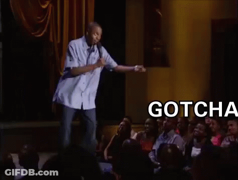 A Man Is Giving A Speech In Front Of A Crowd And The Words Gotcha Bitch Are On The Screen GIF