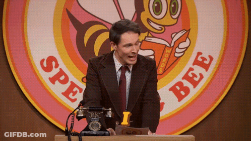 A Man Is Giving A Speech In Front Of A Sign That Says Spe Bee GIF