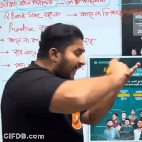 A Man Is Giving A Speech In Front Of A Whiteboard With Foreign Writing On It . GIF