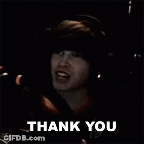 A Man Is Giving A Thumbs Up And The Words Thank You Are Above Him . GIF
