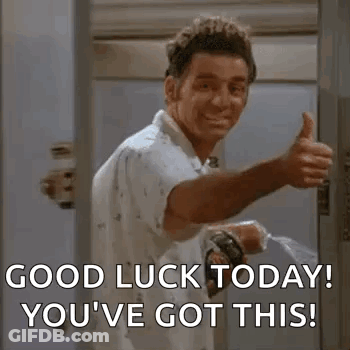 A Man Is Giving A Thumbs Up In Front Of A Door While Holding A Spray Bottle . GIF