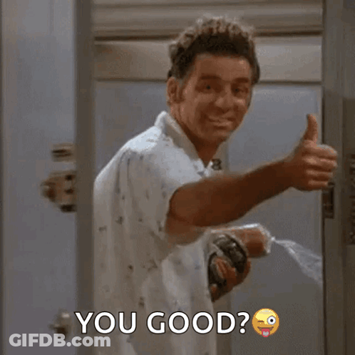 A Man Is Giving A Thumbs Up While Holding A Bottle Of Water . GIF