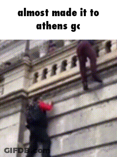 A Man Is Hanging From A Building With The Words " Almost Made It To Athens " Below Him GIF