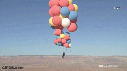 A Man Is Hanging From A Bunch Of Balloons With A Youtube Originals Logo In The Corner GIF