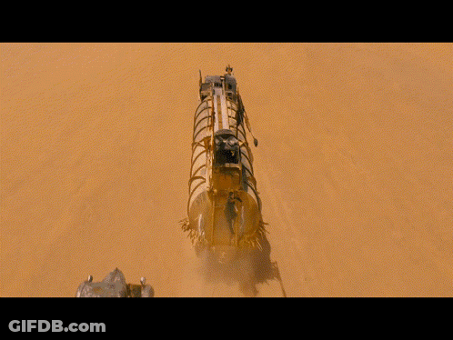 A Man Is Hanging From A Rope Next To A Vehicle GIF