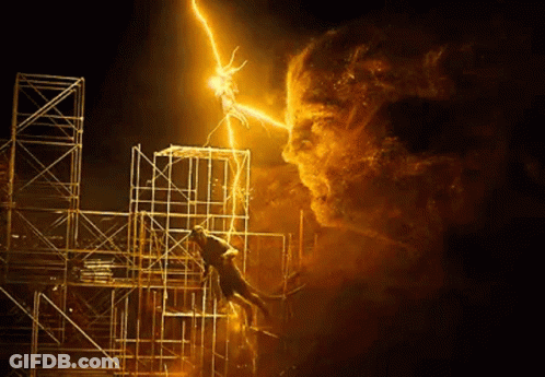A Man Is Hanging From A Scaffolding While A Lightning Bolt Strikes Him . GIF