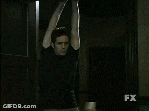 A Man Is Hanging Upside Down With The Words " He 'S Lying " Above Him GIF