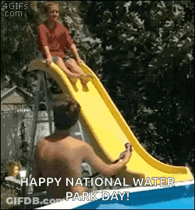 A Man Is Helping A Child On A Water Slide . GIF