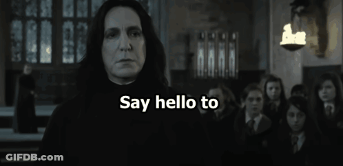 A Man Is Holding A Banana In Front Of A Group Of People And The Words Banananaa Are Visible GIF