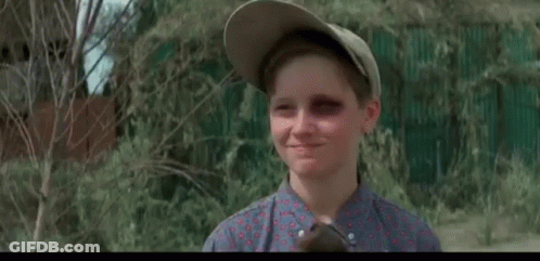 A Man Is Holding A Baseball Bat And A Boy Is Holding A Bat . GIF