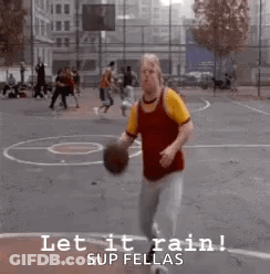 A Man Is Holding A Basketball On A Basketball Court And Says Let It Rain ! GIF