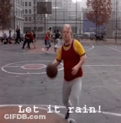 A Man Is Holding A Basketball On A Basketball Court With The Words Let It Rain Below Him GIF